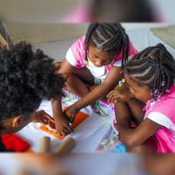 Three children are playing with a toy.