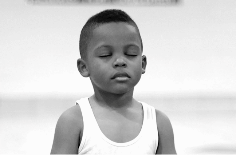 closeup shot of a little boy with eye closed